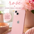 iPhone 13 rose posé sur une table en bois, entouré d'accessoires quotidiens.